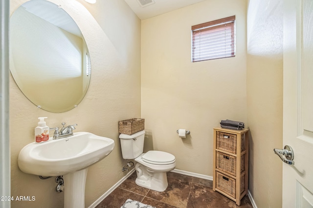 bathroom featuring toilet