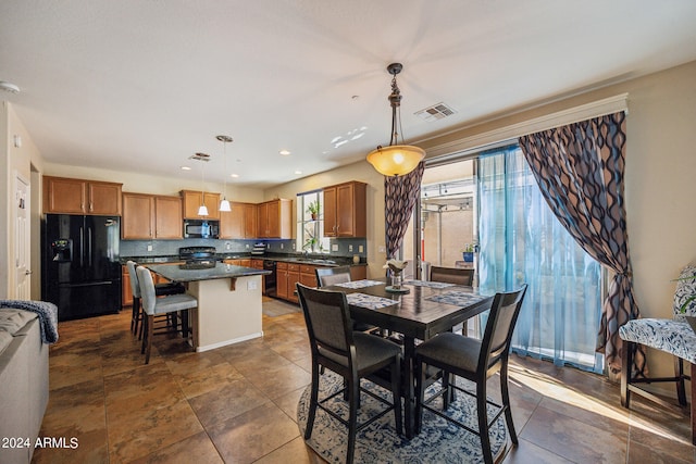 dining room featuring sink