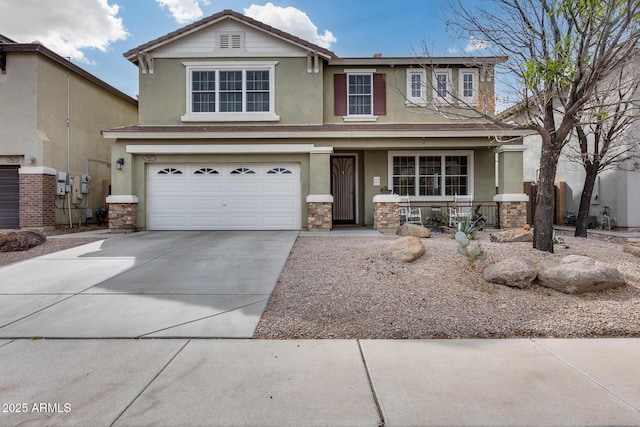 view of front facade with stucco siding, a porch, driveway, and a garage