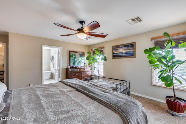 bedroom featuring visible vents, ensuite bath, carpet, baseboards, and ceiling fan