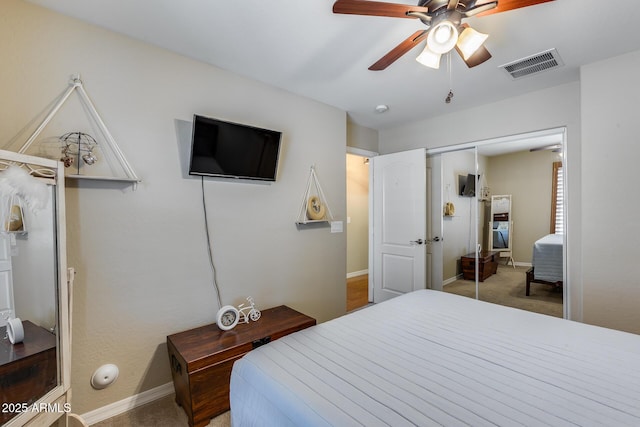 bedroom with visible vents, baseboards, and carpet