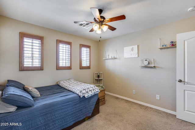 bedroom featuring visible vents, light colored carpet, baseboards, and ceiling fan