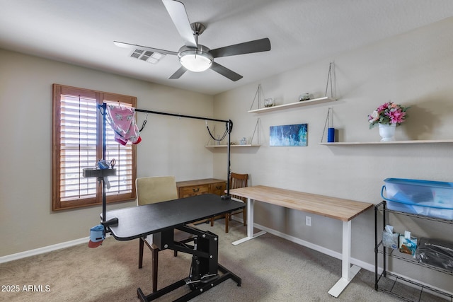 workout room featuring carpet flooring, baseboards, visible vents, and ceiling fan