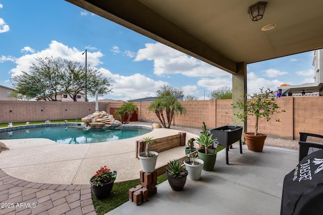 view of pool with a fenced in pool, a patio, and a fenced backyard