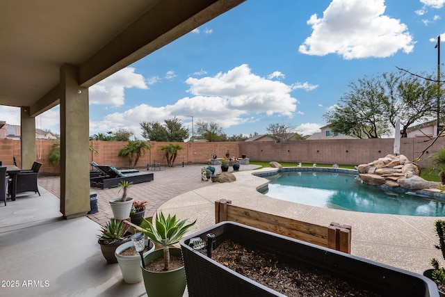 view of pool with a fenced in pool, a patio, and a fenced backyard