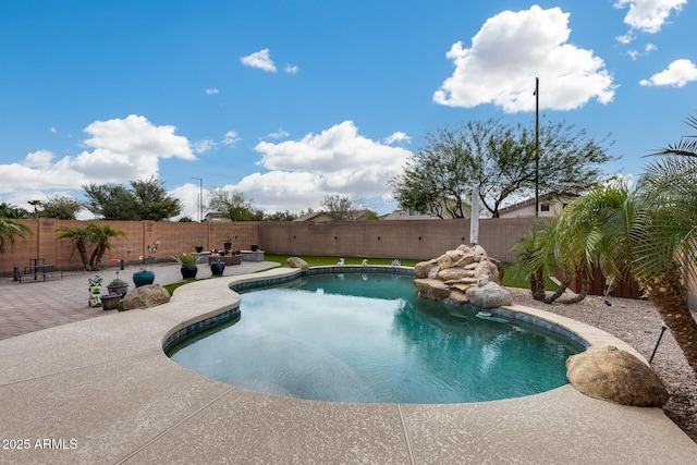 view of pool with a fenced in pool, a fenced backyard, and a patio area