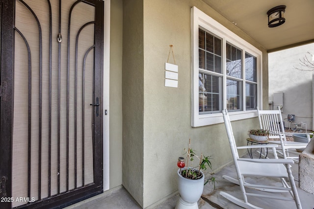 view of exterior entry with stucco siding