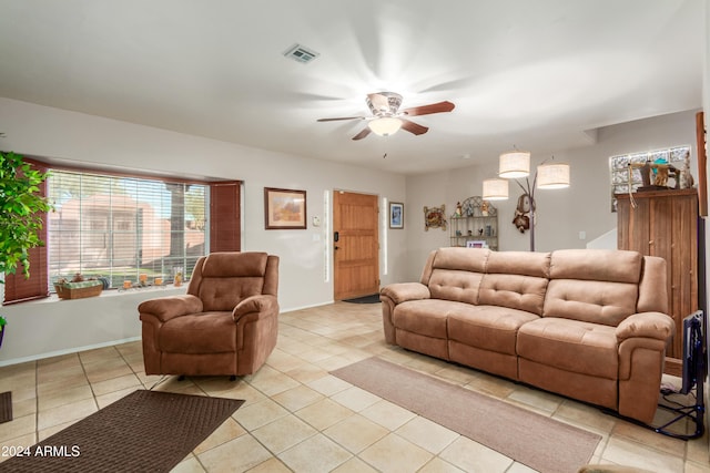 47012 N New River Rd, New River, AZ 85087 - living room with ceiling fan, light tile patterned floors, and baseboards