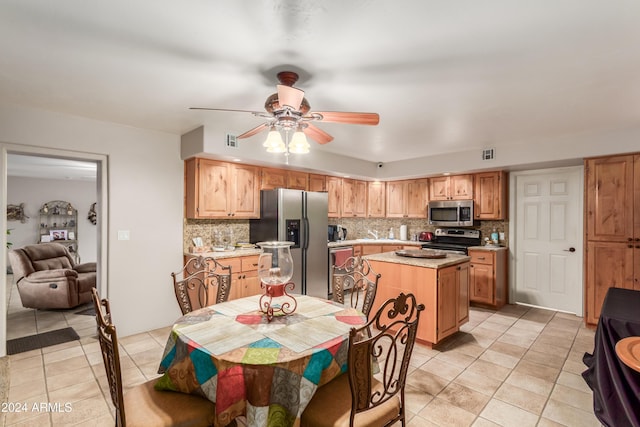 47012 N New River Rd, New River, AZ 85087 - dining area featuring light tile patterned floors and a ceiling fan