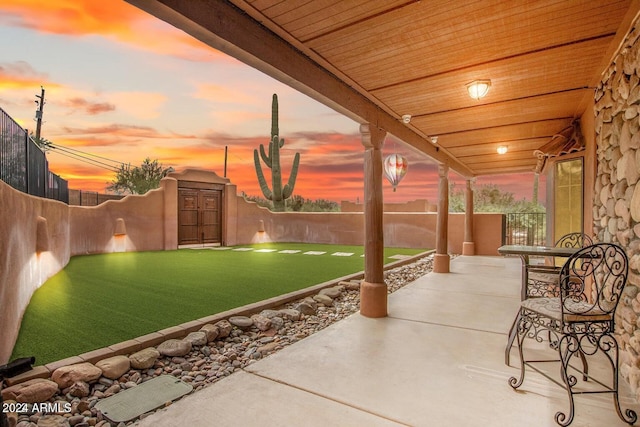 47012 N New River Rd, New River, AZ 85087 - patio terrace at dusk featuring a patio area