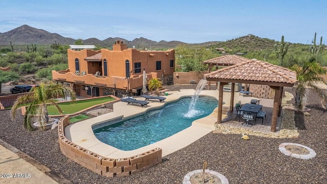47012 N New River Rd, New River, AZ 85087 - view of swimming pool with a gazebo, a mountain view, an area to practice putting, and a patio