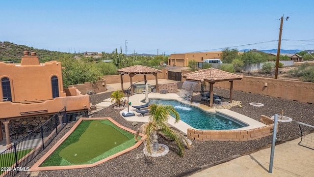 47012 N New River Rd, New River, AZ 85087 - view of pool with a gazebo, a putting area, a fenced backyard, and a patio