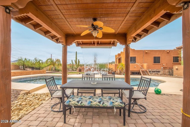 47012 N New River Rd, New River, AZ 85087 - view of patio with an outdoor pool, outdoor dining space, and a ceiling fan