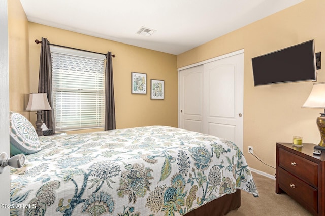 carpeted bedroom with a closet