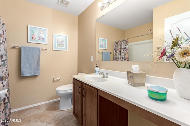 bathroom featuring tile patterned flooring, vanity, curtained shower, and toilet