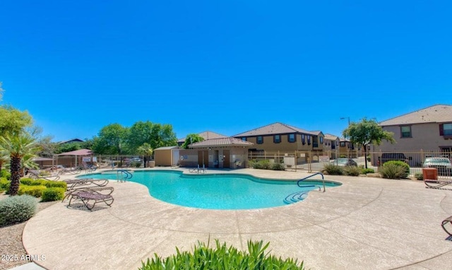 view of swimming pool with a patio