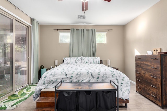 bedroom featuring access to outside, ceiling fan, and light wood-type flooring