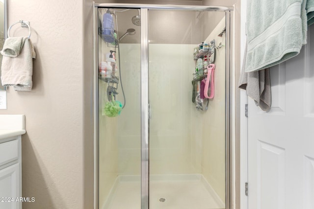 bathroom featuring vanity and walk in shower