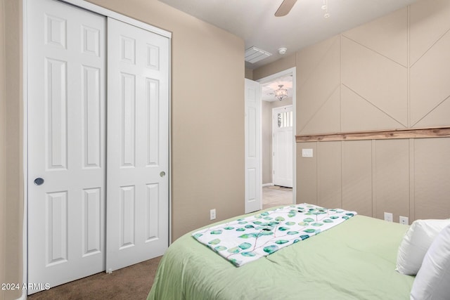 bedroom featuring carpet flooring, a closet, and ceiling fan