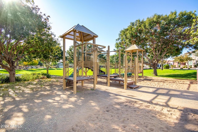 view of playground with a lawn