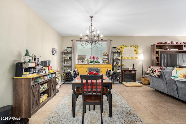 tiled dining room featuring a chandelier