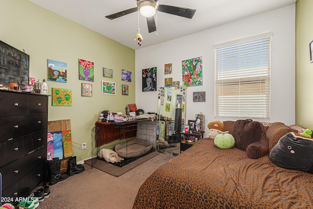 bedroom with ceiling fan and carpet