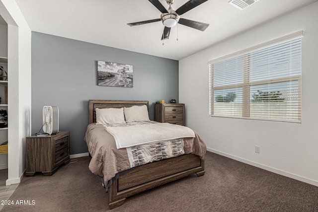 bedroom with dark carpet and ceiling fan