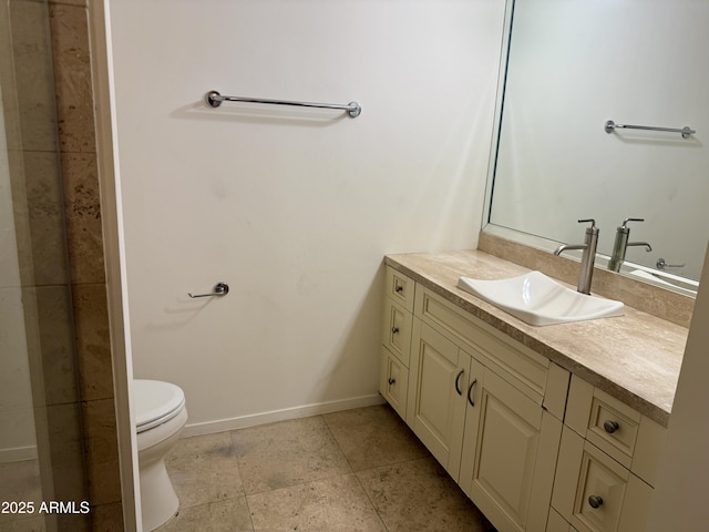 bathroom with tile patterned floors, vanity, and toilet