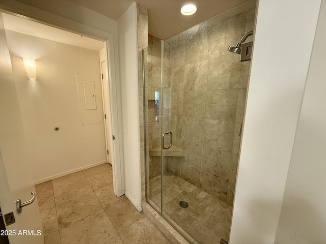 bathroom featuring tile patterned floors and a shower with door