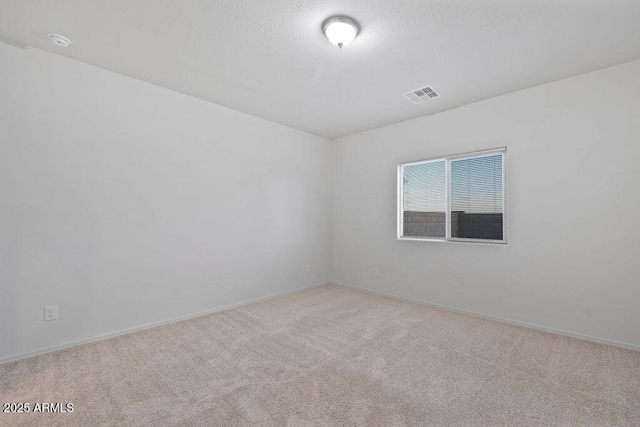 43637 W Cypress Ln, Maricopa, AZ 85138 - carpeted spare room featuring baseboards, a textured ceiling, and visible vents