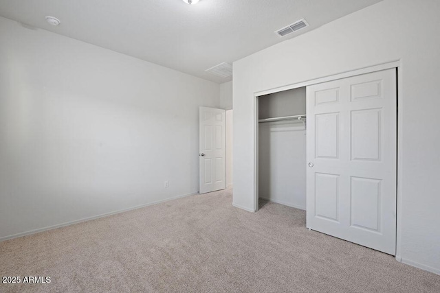 43637 W Cypress Ln, Maricopa, AZ 85138 - unfurnished bedroom with baseboards, carpet, a closet, and visible vents