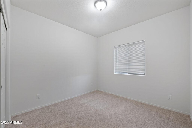 43637 W Cypress Ln, Maricopa, AZ 85138 - spare room with carpet, baseboards, and a textured ceiling