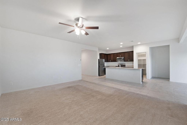 43637 W Cypress Ln, Maricopa, AZ 85138 - unfurnished living room featuring light tile patterned floors, recessed lighting, light colored carpet, and ceiling fan