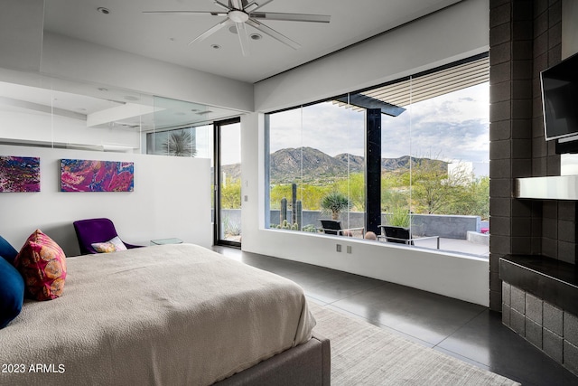 bedroom featuring tile patterned floors and ceiling fan