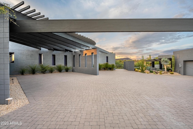 view of patio terrace at dusk