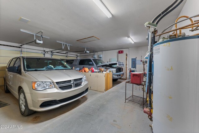 22900 W Hylton Way, Congress, AZ 85332 - garage featuring water heater, a garage door opener, and electric panel