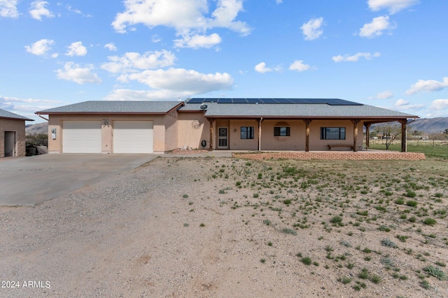 22900 W Hylton Way, Congress, AZ 85332 - view of front facade with a garage and solar panels