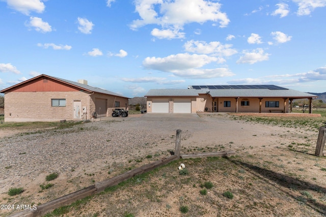 22900 W Hylton Way, Congress, AZ 85332 - ranch-style house featuring solar panels and a garage