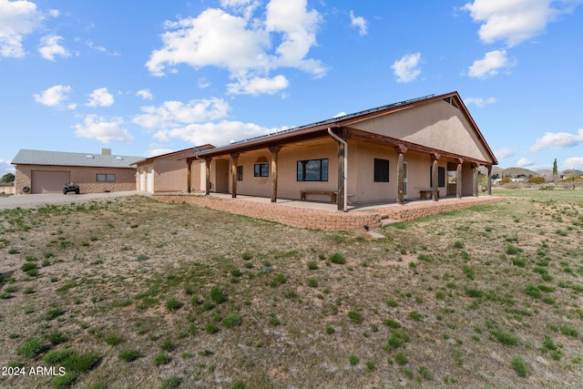 22900 W Hylton Way, Congress, AZ 85332 - rear view of house featuring a patio and a lawn