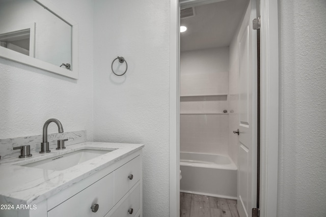 bathroom with wood-type flooring and vanity