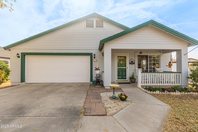 single story home with a garage and covered porch