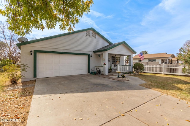 ranch-style house with a garage and covered porch