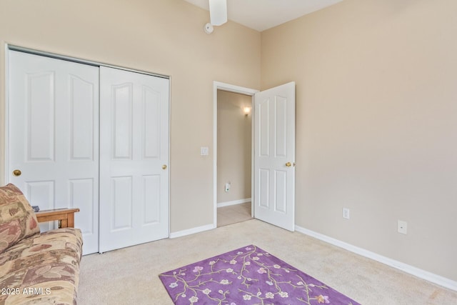 unfurnished room featuring light carpet