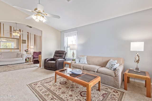 carpeted living room featuring vaulted ceiling and ceiling fan