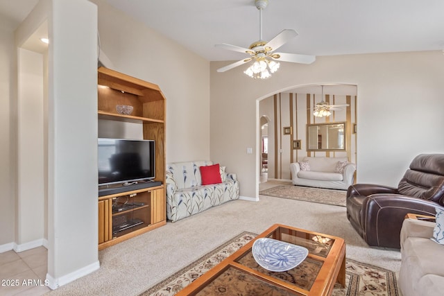 carpeted living room with ceiling fan