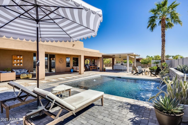 view of pool featuring an outdoor living space, a fenced in pool, fence, and a patio area