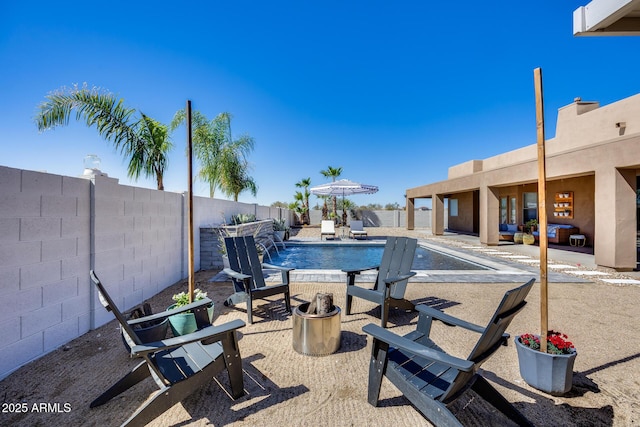 view of patio / terrace featuring a fenced backyard and a fenced in pool