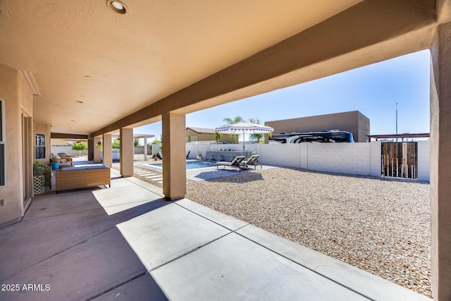 view of patio / terrace featuring a fenced in pool, a fenced backyard, and an outdoor hangout area