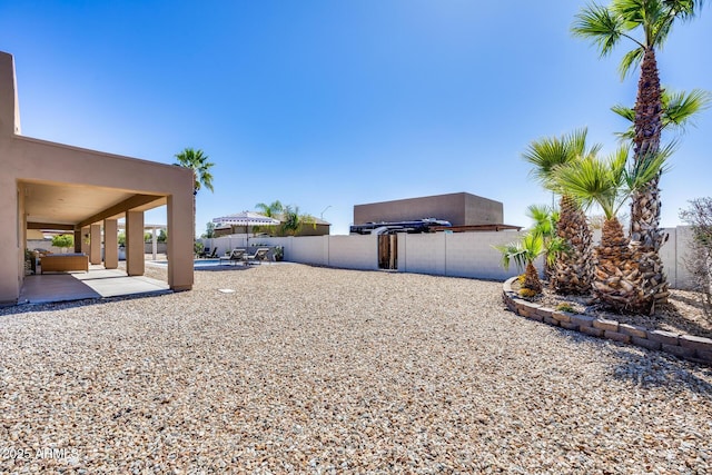 view of yard with a fenced backyard and a patio area