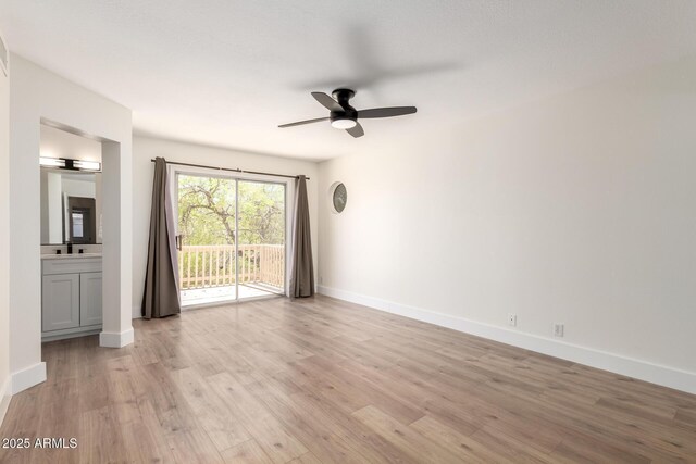 7702 W Piute Ave, Glendale, AZ 85308 - unfurnished room featuring a ceiling fan, light wood-style floors, and baseboards